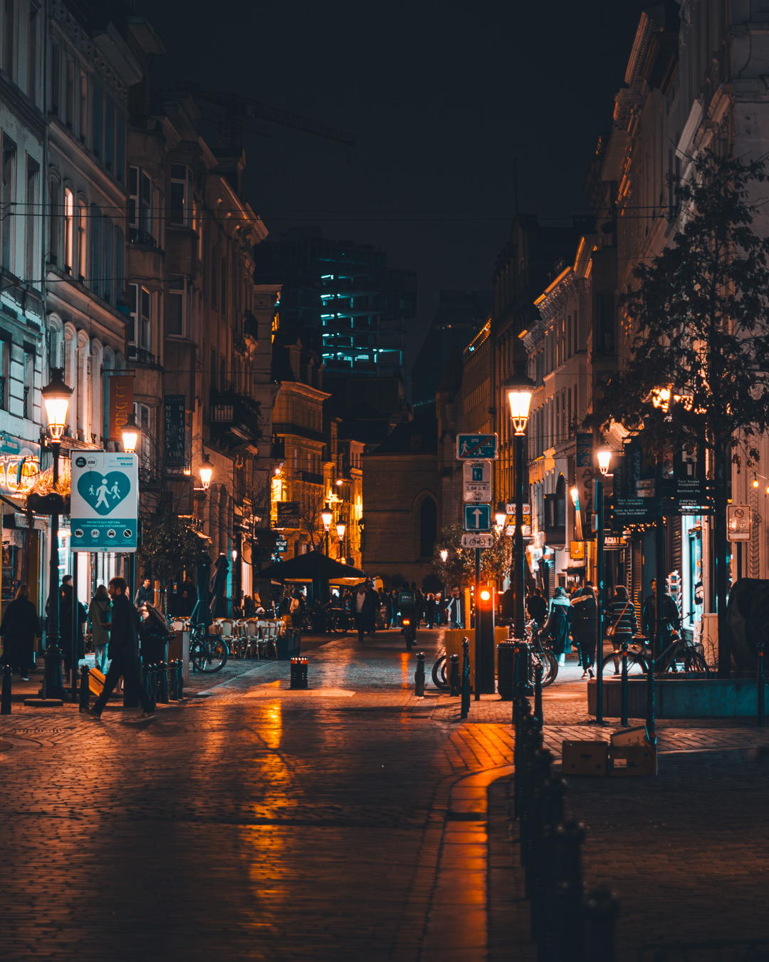 Street at night in Brussels with construction in the background