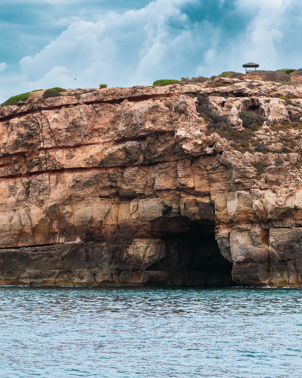 dark cave in a cliffside