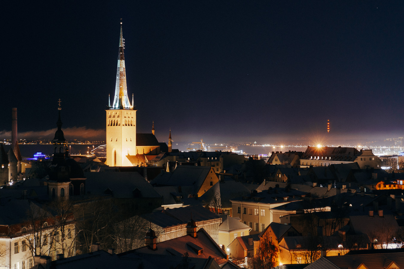 View of church tower and old town buildings during the day